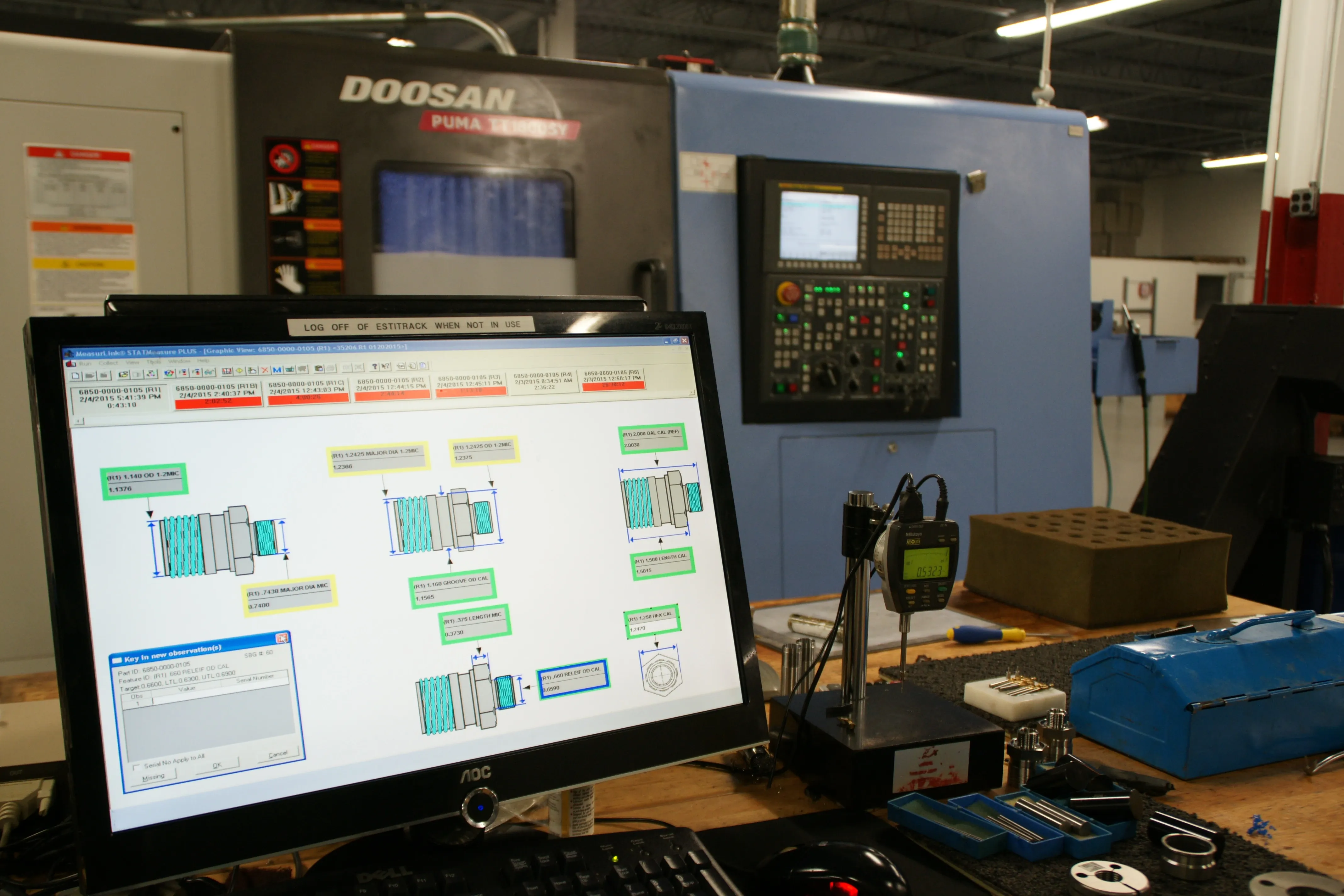 SPC software tracking part dimensions beside a Doosan turning center